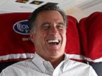 PHOTO: Then Republican presidential candidate Mitt Romney, right, laughs as his senior adviser and spokesman, Kevin Madden, works on his laptop on his campaign plane, Oct. 29, 2012, en route to Moline, Ill.
