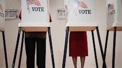 PHOTO: Voters voting in polling place