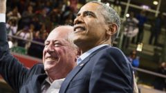 PHOTO: President Barack Obama, right, stands with Illinois Gov. Pat Quinn, left, during a campaign rally at Chicago State University in Chicago on Oct. 19, 2014.