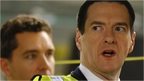 George Osborne (right) looks at a car on the production line at Bentley Motors in Crewe