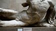 A naked, headless statue, part of a collection of stone objects, inscriptions and sculptures, known as the Elgin Marbles on display in the British Museum