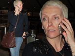 Australian actress Toni Collette is spotted chatting on her cellphone as she arrives at LAX Airport in Los Angeles, Ca\n\nPictured: Toni Collette\nRef: SPL904307  031214  \nPicture by: Chessa /London Entertainment\n\nSplash News and Pictures\nLos Angeles: 310-821-2666\nNew York: 212-619-2666\nLondon: 870-934-2666\nphotodesk@splashnews.com\n