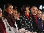 U.S. President Barack Obama and his family, daughters Malia (L) and Sasha (2nd L), first lady Michelle Obama (C) and mother-in-law Marian Robinson (R), attend the lighting of the National Christmas Tree on the Ellipse near the White House in Washington, December 4, 2014.       REUTERS/Larry Downing   (UNITED STATES - Tags: POLITICS ENTERTAINMENT SOCIETY)