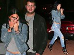 UK CLIENTS MUST CREDIT: AKM-GSI ONLY
EXCLUSIVE: Calabasas, CA - Kylie Jenner buried her face in her hands when she was caught on a sushi dinner date with a new guy.  Kylie's companion did not appear to be as camera shy as he escorted her through the Sugarfish Sushi parking lot. The 17-year-old reality star showed off her midriff beneath a grey tee paired with a jean jacket, ripped jeans and Christian Louboutin leather lace up ankle boots.

Pictured: Kylie Jenner
Ref: SPL905256  041214   EXCLUSIVE
Picture by: AKM-GSI / Splash News