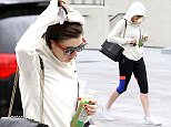UK CLIENTS MUST CREDIT: AKM-GSI ONLY
EXCLUSIVE: **SHOT ON 12/3/14** Anne Hathaway throws her hoodie over her head to take cover from the rain after visiting her gym for a workout in Los Angeles. Despite the gloomy weather, Anne got herself motivated to get out of the house for some exercise.

Pictured: Anne Hathaway
Ref: SPL904789  041214   EXCLUSIVE
Picture by: AKM-GSI / Splash News