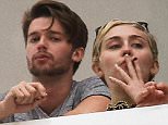 Picture Shows: Patrick Schwarzenegger, Miley Cyrus  December 04, 2014\n \n New couple Miley Cyrus and Patrick Schwarzenegger are spotted smoking some funny looking cigarettes on their hotel balcony in Miami, Florida. Patrick's conservative mom is reportedly worried about Miley's wild ways and her influence on the 21-year-old Schwarzenegger. \n \n Non-Exclusive\n UK RIGHTS ONLY\n \n Pictures by : FameFlynet UK © 2014\n Tel : +44 (0)20 3551 5049\n Email : info@fameflynet.uk.com