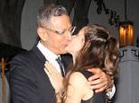 Jeff Goldblum and new wife Emilie Livingston lock lips while waiting for the valet after the GQ party, held at Chateau Marmont in West Hollywood. December 4, 2014