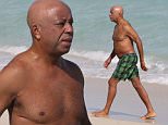129935, Russell Simmons takes a dip in the ocean on Miami Beach. Russell went shirtless as he drove into the ocean this afternoon for a quick swim. Miami, Florida - Friday December 05, 2014. Photograph: Brett Kaffee/Thibault Monnier, ¬© Pacific Coast News. Los Angeles Office: +1 310.822.0419 London Office: +44 208.090.4079 sales@pacificcoastnews.com FEE MUST BE AGREED PRIOR TO USAGE.