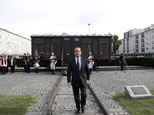 FILE - This Sept. 21, 2012, file photo shows French President Francois Hollande walking back from a train car symbolizing the Drancy camp, during the inauguration of the new Shoah memorial in Drancy, a Paris suburb, France. Hundreds of Americans and others deported by France's state rail company SNCF during the Nazi occupation will be entitled to compensation under a new U.S.-French agreement. The French Foreign Ministry and U.S. State Department announced an accord Friday for a $60 million compensation fund, financed by France and managed by the United States. SNCF transported about 76,000 French Jews to Nazi concentration camps. (AP Photo/Philippe Wojazer, Pool)