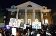 Protestors in front of the Phi Kappa Psi fraternity house at UVA