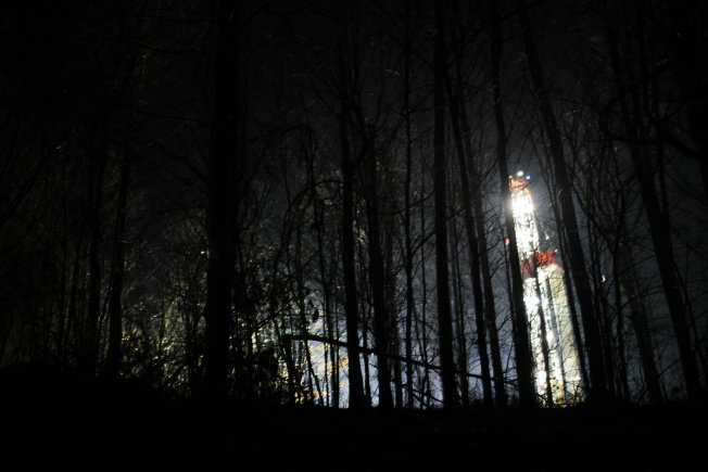 A Cabot Oil and Gas fracking site lights up the woods Jan. 17, 2012, in Springville, Pa. The U.S. Forest Service says it will allow leases for fracking in Virginia's George Washington National Forest.