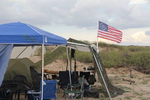 Photos showing dozens of members of the militia groups on the U.S.-Mexico border carrying semi-automatic rifles and wearing masks, camouflage and tactical gear provide one of the first glimpses into the group's activities on the border. Photo: Provided To The San Antonio Express-News