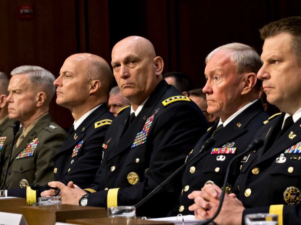FILE - In this June 4, 2013, file photo, military leaders, from right, legal counsel to the Chairman of the Joint Chiefs of Staff Brig. Gen. Richard C. Gross, Joint Chiefs Chairman Gen. Martin Dempsey, Army Chief of Staff Gen. Ray Odierno, Judge Advocate General of the Army Lt. Gen. Dana K. Chipman, Commandant of the Marine Corps Gen. James F. Amos, and Staff Judge Advocate to the Marine Corps Commandant Maj. Gen. Vaughn A. Ary, testify at a Senate Armed Services Committee holds a hearing on Capitol Hill in Washington, about whether a drastic overhaul of the military justice system is needed. (AP Photo/J. Scott Applewhite, File)
