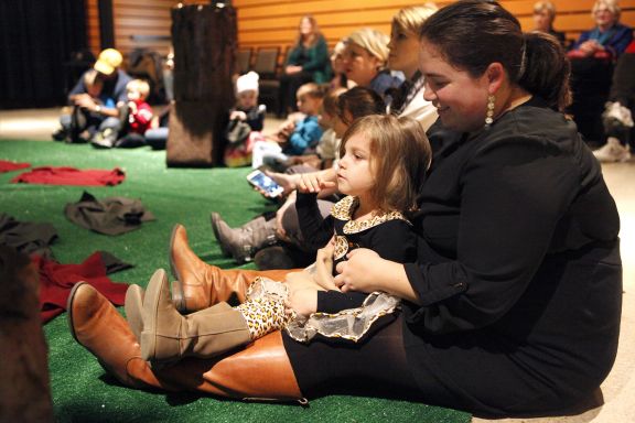 Megan E. Ortiz and her daughter Pistol Brewer, 3, wait for the "Wake Up, Brother Bear" performance to begin Saturday, Nov. 15, 2014 which is put on by The Magik Theatre inside the Pearl Studio. The production is meant for children 5-years-old and under and allows the children to interact with the actors and set. There are four performances scheduled so far on December 13-14 and 20-21, all at the Pearl Studio.