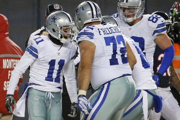 Dallas Cowboys wide receiver Cole Beasley (11) celebrates a touchdown with his teammates during the second half of an NFL football game against the Chicago Bears Thursday, Dec. 4, 2014, in Chicago.