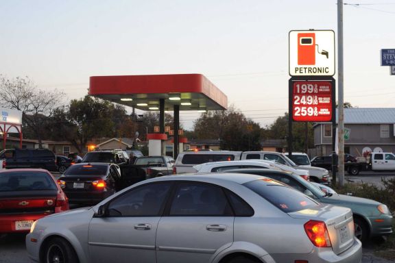 Cars line up at the Fas Stop at at Vance Jackson Road and Spicewood Drive near Loop 410, where gasoline was selling for under $2.00 Friday.