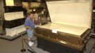 Pat and Betty Elko of Bettendorf, Iowa, look at a casket built for three in the 1930's at the National Museum of Funeral History.