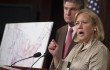 Senator Mary Landrieu, a Democrat from Louisiana, right, speaks as Senator Joe Manchin, a Democrat from West Virginia, looks on during a news conference.