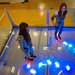 Hannah Lawrence, left, and Rachel Lawrence playing Robot Swarm, an exhibit in which one can control the movement of differently colored robots.