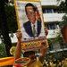 Well-wishers in the royal color, yellow, celebrated the birthday of King Bhumibol Adulyadej and prayed for his health on Friday outside the hospital in Bangkok where he is staying.
