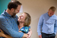 Dr. Rick Sacra, who contracted Ebola in Liberia, left isolation at Nebraska Medical Center in September and was reunited with his wife, Debbie, and son Jared.