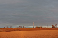 An oil pad on North Dakota's Fort Berthold Indian Reservation flares natural gas produced in the hydrofracturing process. Over a quarter of all natural gas produced in North Dakota is burned off this way.