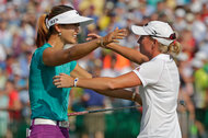 The rivalry between Michelle Wie and Stacy Lewis, embracing after Wie won the United States Open on Sunday, has boosted women's golf.