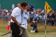 Phil Mickelson, left, and his caddie, Jim Mackay, after Mickelson birdied the final hole and won last year’s British Open. Mackay was overcome with emotion after seeing Mickelson’s victory.