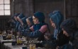 Anne Hathaway (center) and other seamstresses find work in "Les Misérables."