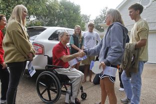 Audrey Abbott, left, joins her father, Attorney General and gubernatorial candidate Greg Abbott, to greet (from right) Matthew Tucker, Ellen Tucker, Michael Tucker and Joy Baughman during a block walk on Nov. 9., 2013, in Austin.