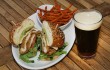 Belly up to East Hampton’s Fried Chicken + Jack, a Southern-fried cutlet with pepper jack cheese, bacon, avocado mash, and greens. Lee Chastain