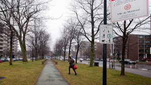 A woman walks through Place du-6-decembre-1989, at the corner of Queen Mary Rd. In December 2011.