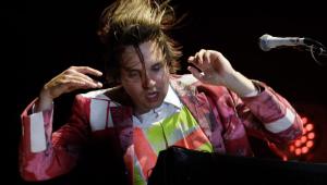 Will Butler of the Montreal band Arcade Fire plays keyboards during the band's concert at Jean Drapeau Park in Aug. 30, 2014.