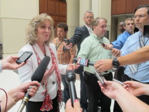State Superintendent Glenda Ritz speaks to reporters outside the State Board of Education meeting in July, when she engaged with board members about her duties as board chair. 