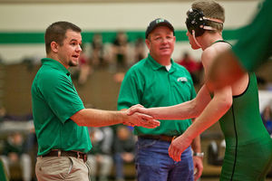 <p>Belgrade wrestling coach Sean Dellwo, left, shakes hands with Josiah Green after his 145-pound bout at the Belgrade Invitational high school wrestling tournament on Friday, Dec. 5, in Belgrade.</p>