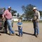 Monte Tucker, left, stands with his son and dad on the family's farm near Sweetwater, Okla.