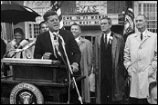 An image of President Kennedy speaking to a crowd in Fort Worth, TX. 