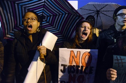 Alexis Payne,17, of Oakland, left, and Philippa Zang,13, of South Side Alexis Payne,17, of Oakland, left, and Philippa Zang,13, of South Side, both CAPA students, speak out at the Friday night rally at Schenley Plaza in Oakland.