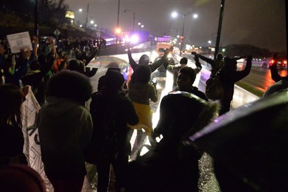 Protesters march from down the Fifth Avenue entrance ramp  Protesters march from down the Fifth Avenue entrance ramp onto the Parkway East in Oakland Friday night causing traffic to come to a stand still.