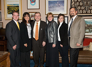 Photo of Senator Domenici with DPNM attorney Ryan Miltner; staffer Kaye Dunnahoo and executive director Sharon Lombardi, both of Roswell; and Dyanne Gonzales of Clovis, and Robert Hagevoort, extension dairy specialist at the NMSU Agricultural Science Center at Clovis