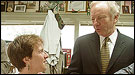 Photo of Senator and a constituent talking in a diner stop.