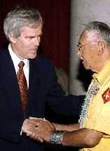 Color photo of Senator Bingaman shaking hands with a Navajo Code Talker.