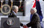 After delivering his remarks, President George W. Bush shakes hands with Australian Prime Minister John Howard during the State Arrival Ceremony held for the Prime Minister on the South Lawn Tuesday, May 16, 2006. White House photo by Paul Morse