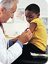 A child recieving a shot from a doctor.