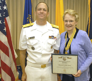 Dr. Duke displays her Surgeon General's Medallion with Acting Surgeon General RADM Steven K. Galson.