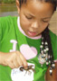 Girl holding a crayfish. This photo, submitted by S. Gilmore, was a finalist in the 2008 Earth Day Photo Contest.