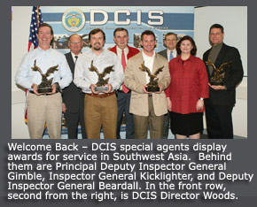 Welcome Back – DCIS special agents display awards for service in Southwest Asia.  Behind them are Principal Deputy Inspector General Gimble, Inspector General Kicklighter, and Deputy Inspector General Beardall. In the front row, second from the right, is DCIS Director Woods.   