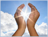 Cupped Hands Held Up in Front of the Sun