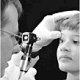 A young boy receiving an eye exam