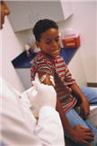boy receiving immunization shot